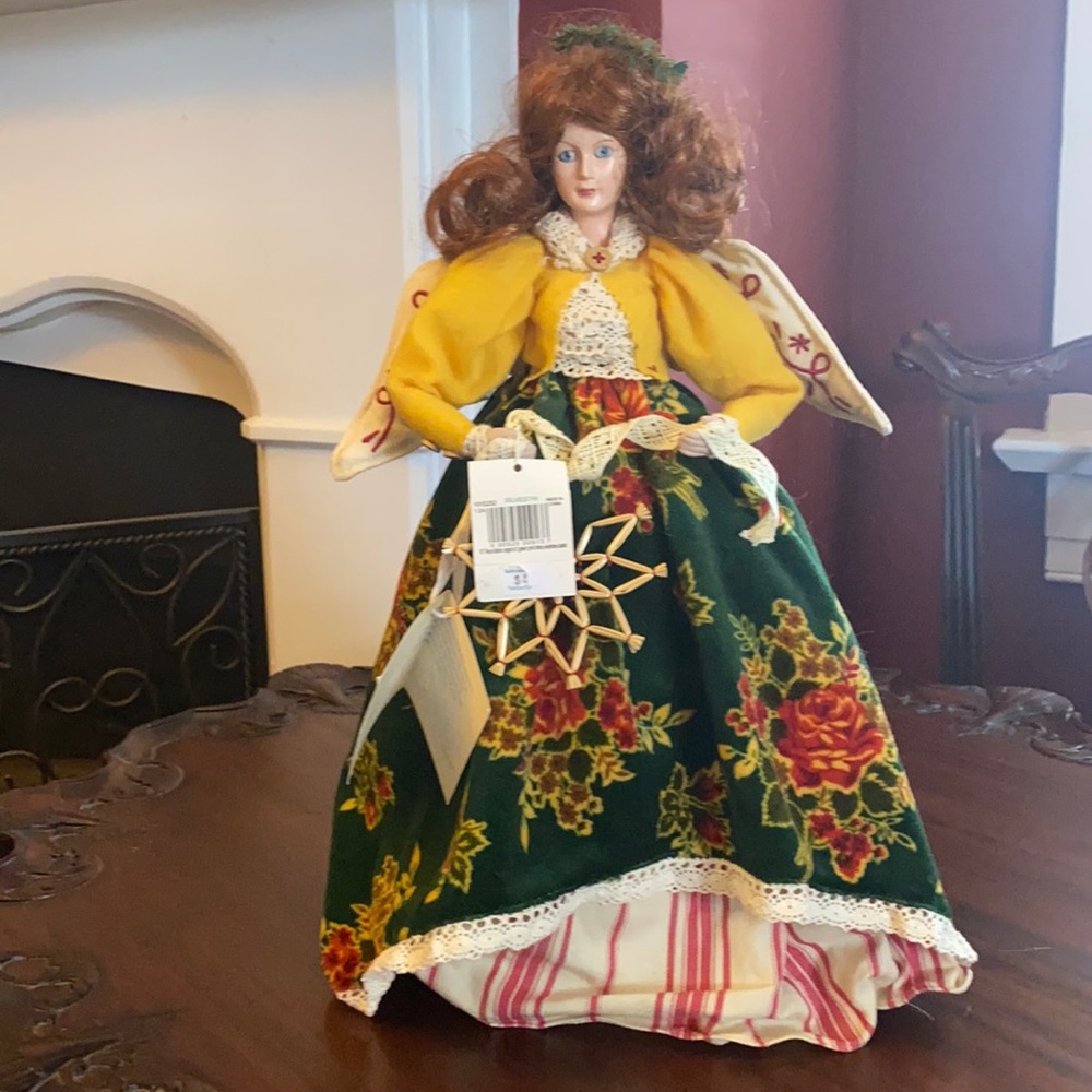 April Cornell for Silvestri tree topper with red hair, blue eyes, velvet dress